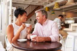 Mature couple having coffee together